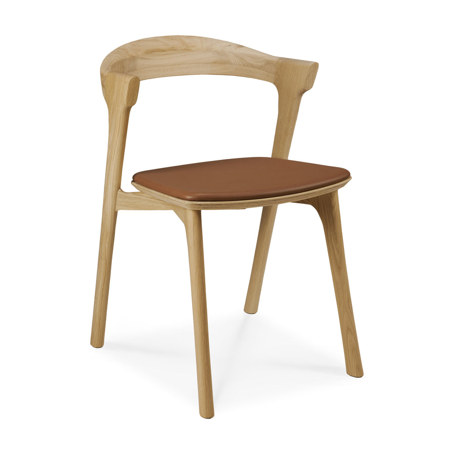 Ethnicraft Bok cognac leather dining chair at a side angle