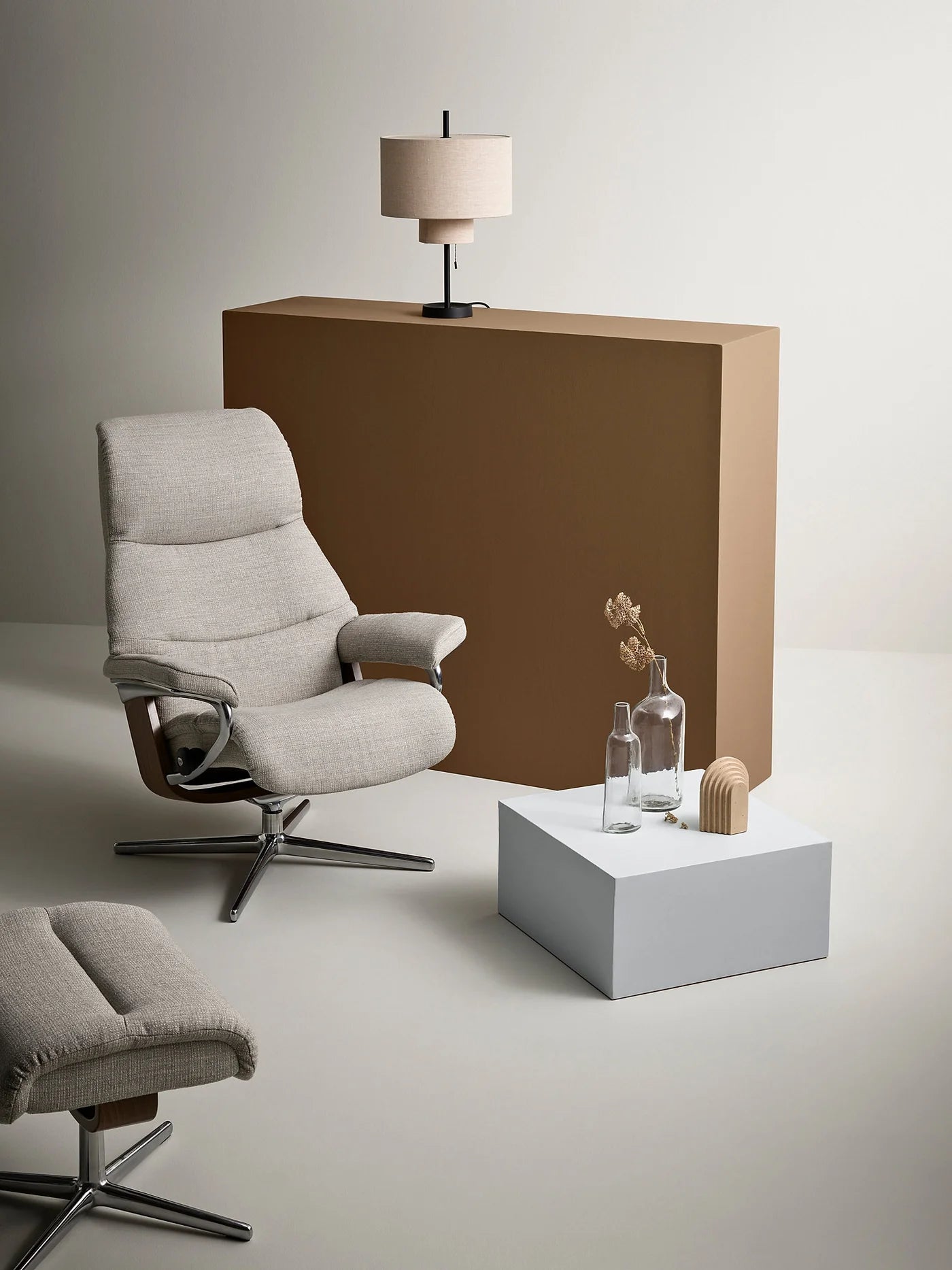 Stressless View recliner in Abelia Light Grey fabric with walnut wood and polished Cross base in a warm neutral room
