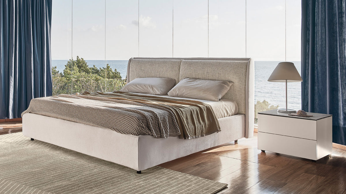 Calligaris Dolly bed — upholstered bed in a coastal bedroom setting