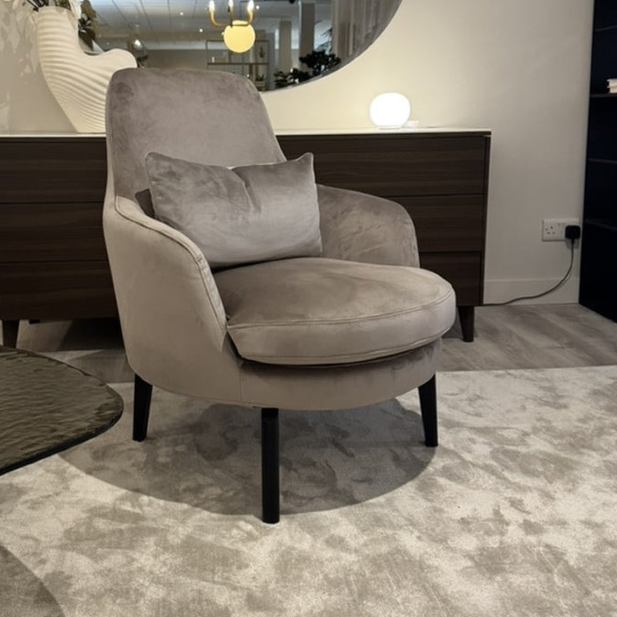 Calligaris Medea lounge chair with Cassiar bolster — closer square showroom view showing the whole chair and all legs