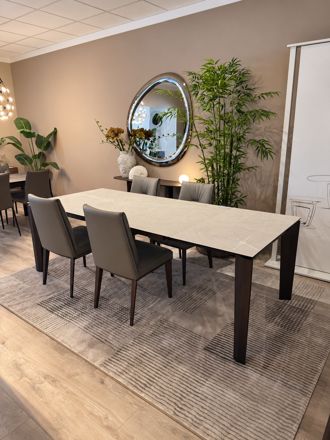 Calligaris Alpha table extended to 240 cm — angled view showing the extension joint, Smoke ash legs and Romy leather chairs