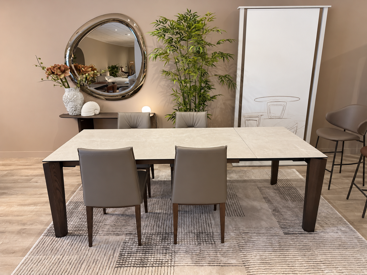 Calligaris Alpha Dolomite ceramic table extended to 240 cm, with four Romy leather chairs — front view