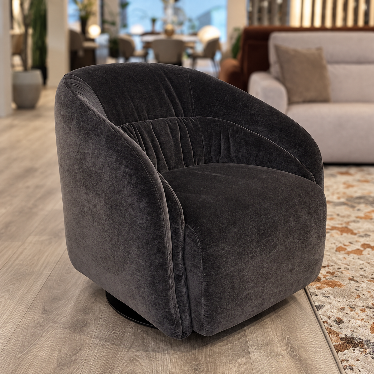 Natuzzi Editions Botao swivel chair in Cupido Dark Timber fabric — showroom view