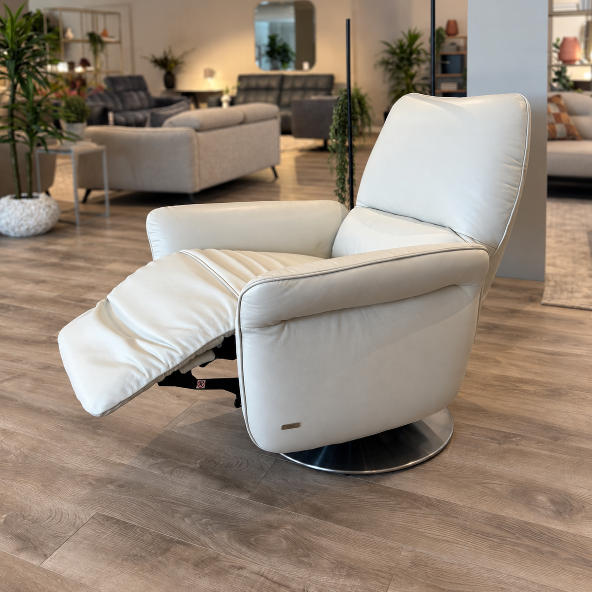 Natuzzi Editions Angelica power swivel armchair in Le Mans Snow leather, reclined, photographed in the Fultons showroom