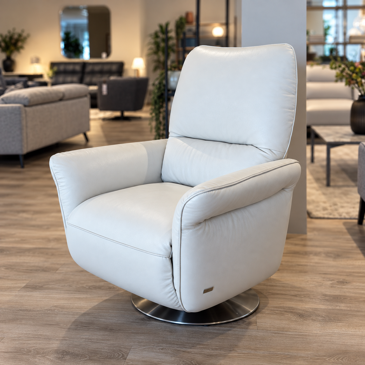 Natuzzi Editions Angelica power swivel armchair in Le Mans Snow leather, upright, photographed in the Fultons showroom