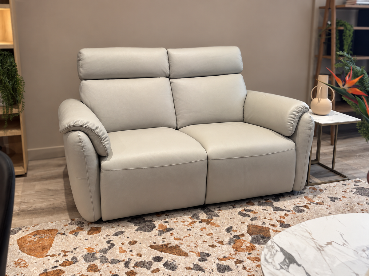 Natuzzi Editions Houston power sofa in Le Mans Light Grey leather, angled view, photographed in the Fultons showroom