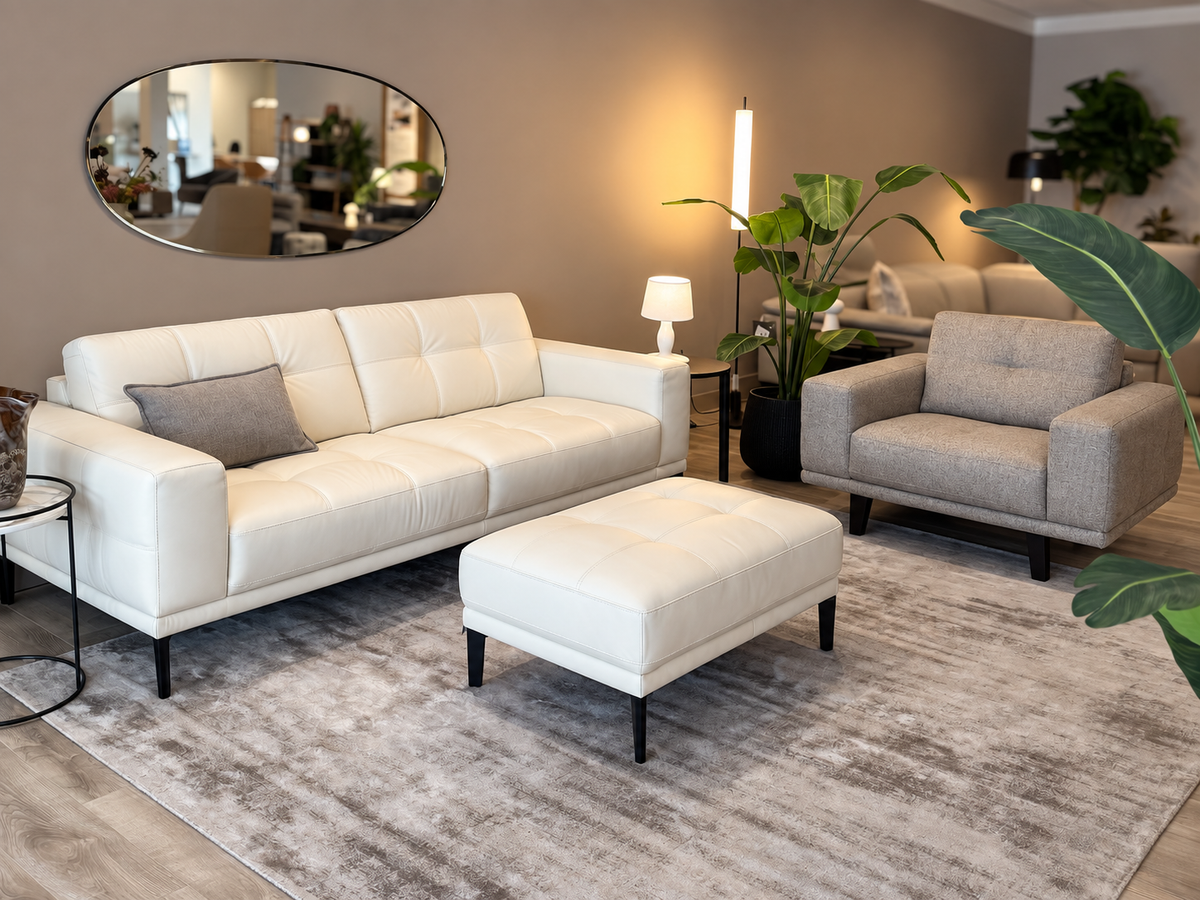Natuzzi Editions Toledo set with white leather sofa and stool and beige melange fabric armchair, photographed in the Fultons showroom