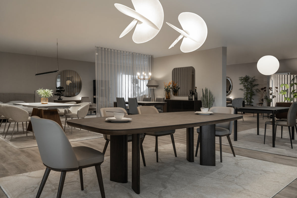 A dining table and chairs in a Fultons showroom setting.