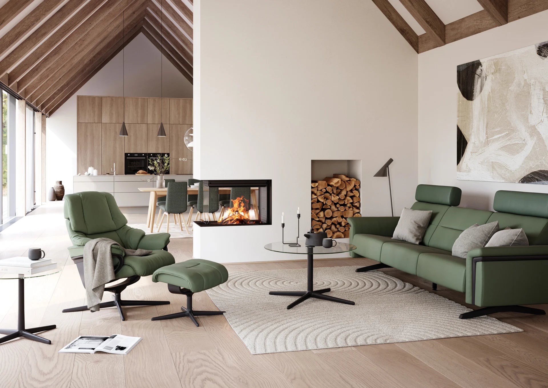 Green Stressless recliner, footstool and sofa beside a fireplace in a timber-framed room