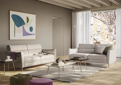 Natuzzi Editions Greg sofa in light upholstery in a sunlit living room with wooden flooring