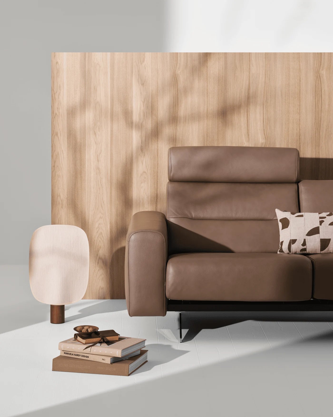 Stressless Stella S1 sofa in brown Velaro Mole leather against sunlit wood panelling
